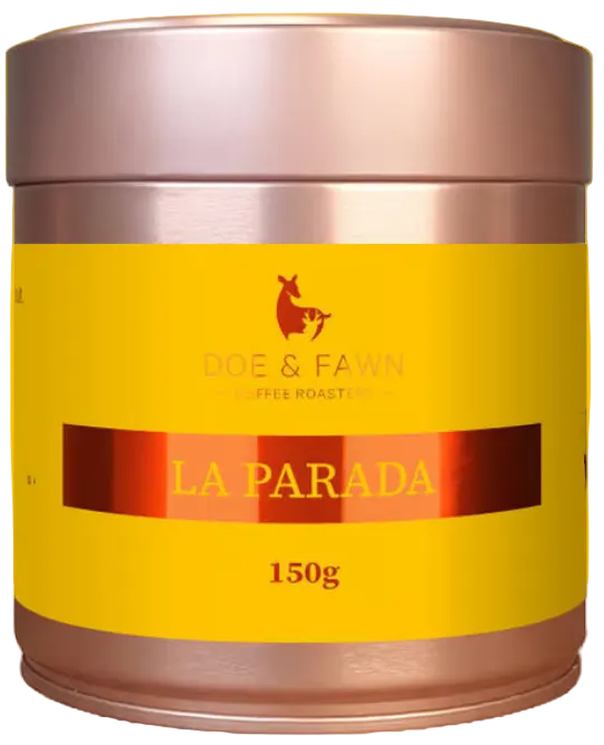 A 150g canister of Rode & Fawn Coffee Roasting 'La Parada' coffee, featuring a bright yellow label and metallic rose gold lid and base, set against a yellow circular graphic on a white background.